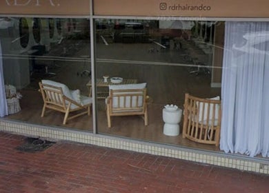 Relaxing lounge at Shh Beauty Secrets, Croydon, Victoria, AU with cozy wooden chairs and curtains.