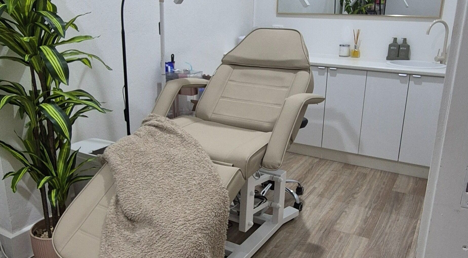 Luxurious treatment room at Shh Beauty Secrets, Croydon, Victoria, AU with a plush chair and cozy blanket.