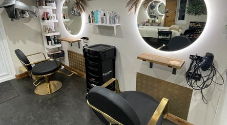 Elegant salon chairs at Ivory Hair by Franki, Rochester, England, GB, with modern decor and styling tools.