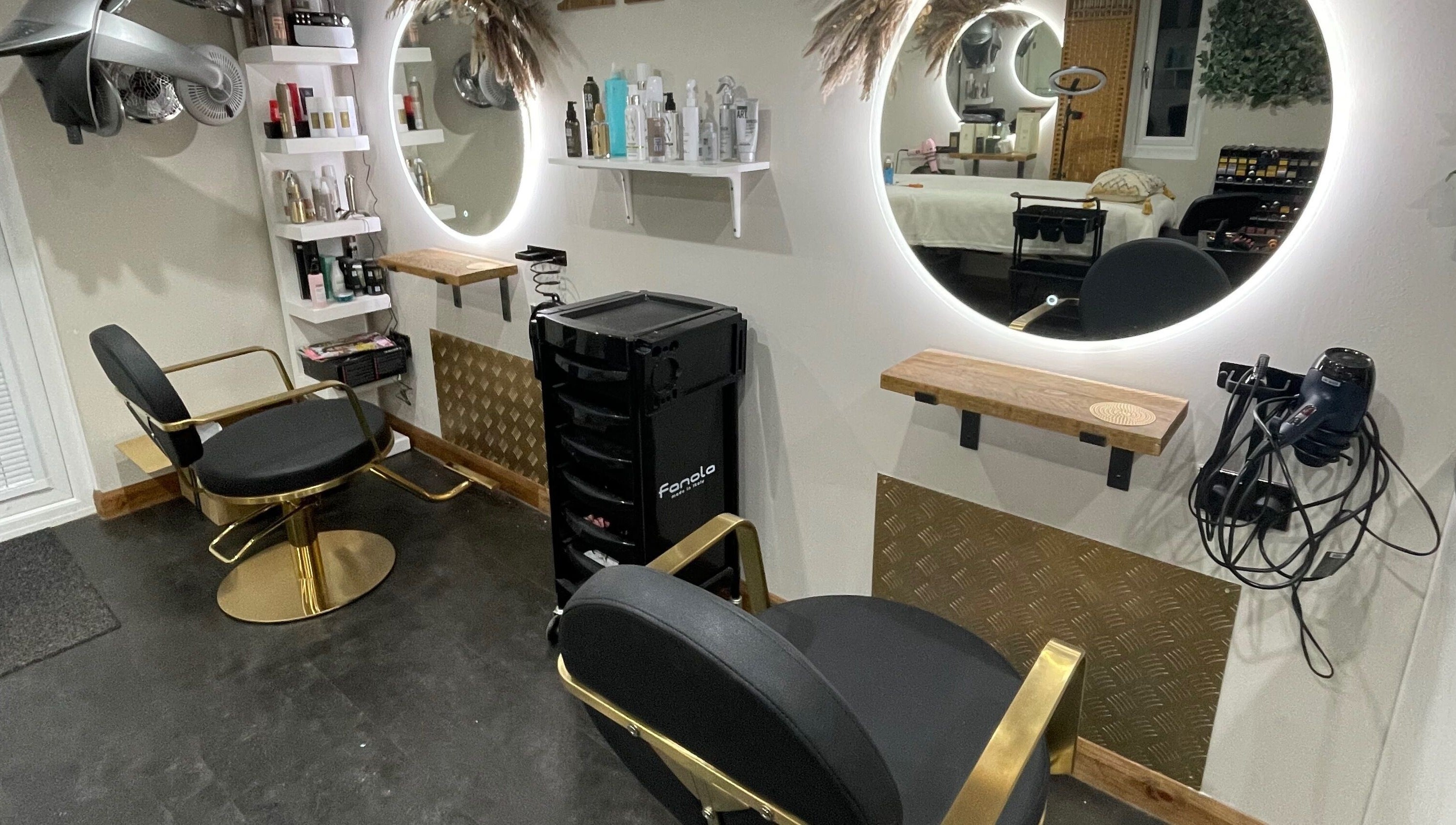 Ivory Hair by Franki in Rochester, England, GB features luxurious styling chairs and illuminated mirrors.