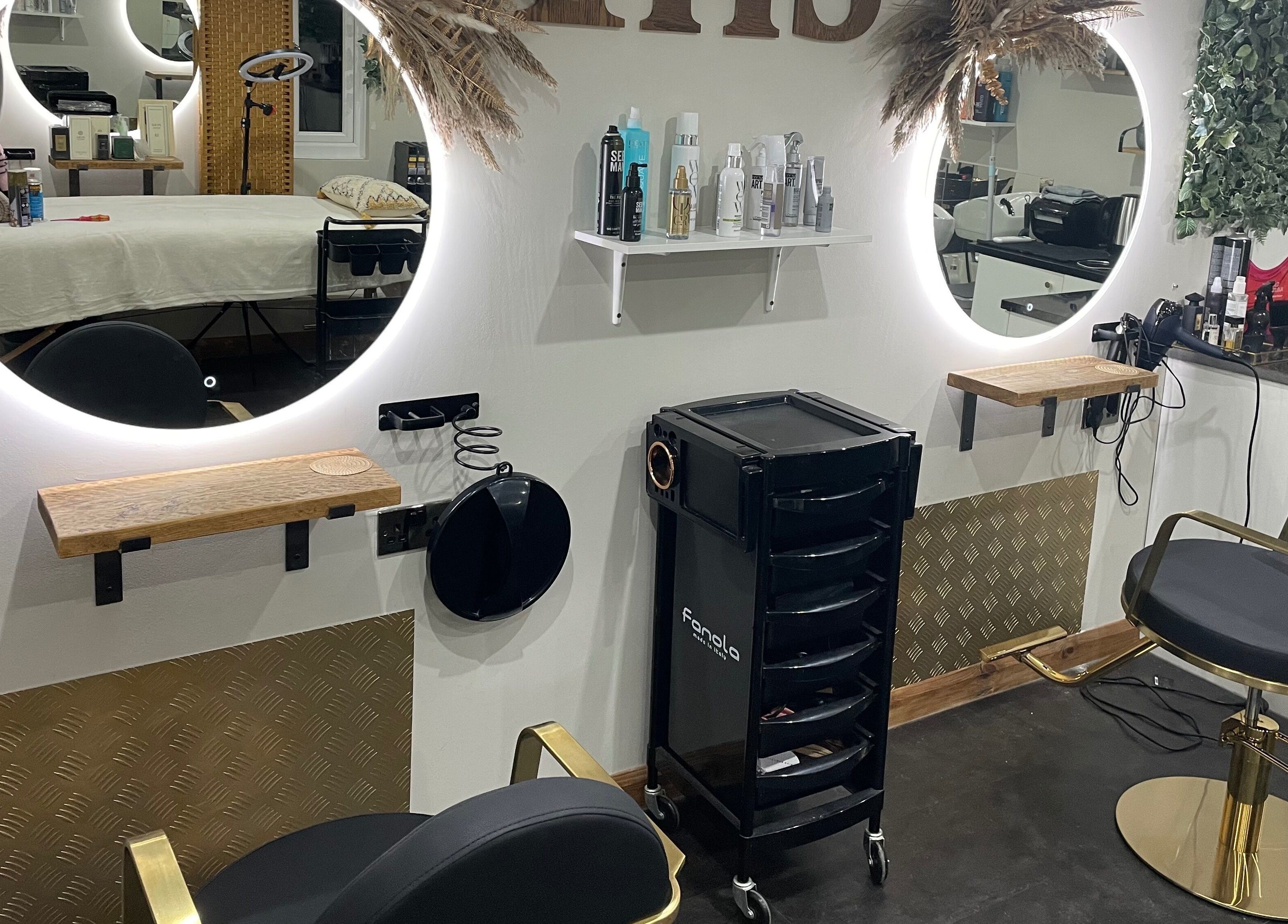 Elegant salon setup at Ivory Hair by Franki in Rochester, England, GB featuring sleek salon chairs and mirrors.