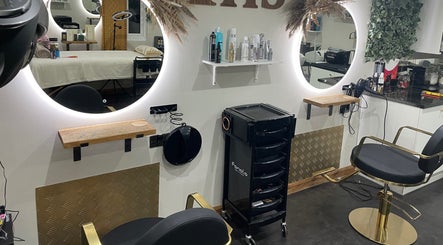Elegant salon setup at Ivory Hair by Franki in Rochester, England, GB featuring sleek salon chairs and mirrors.
