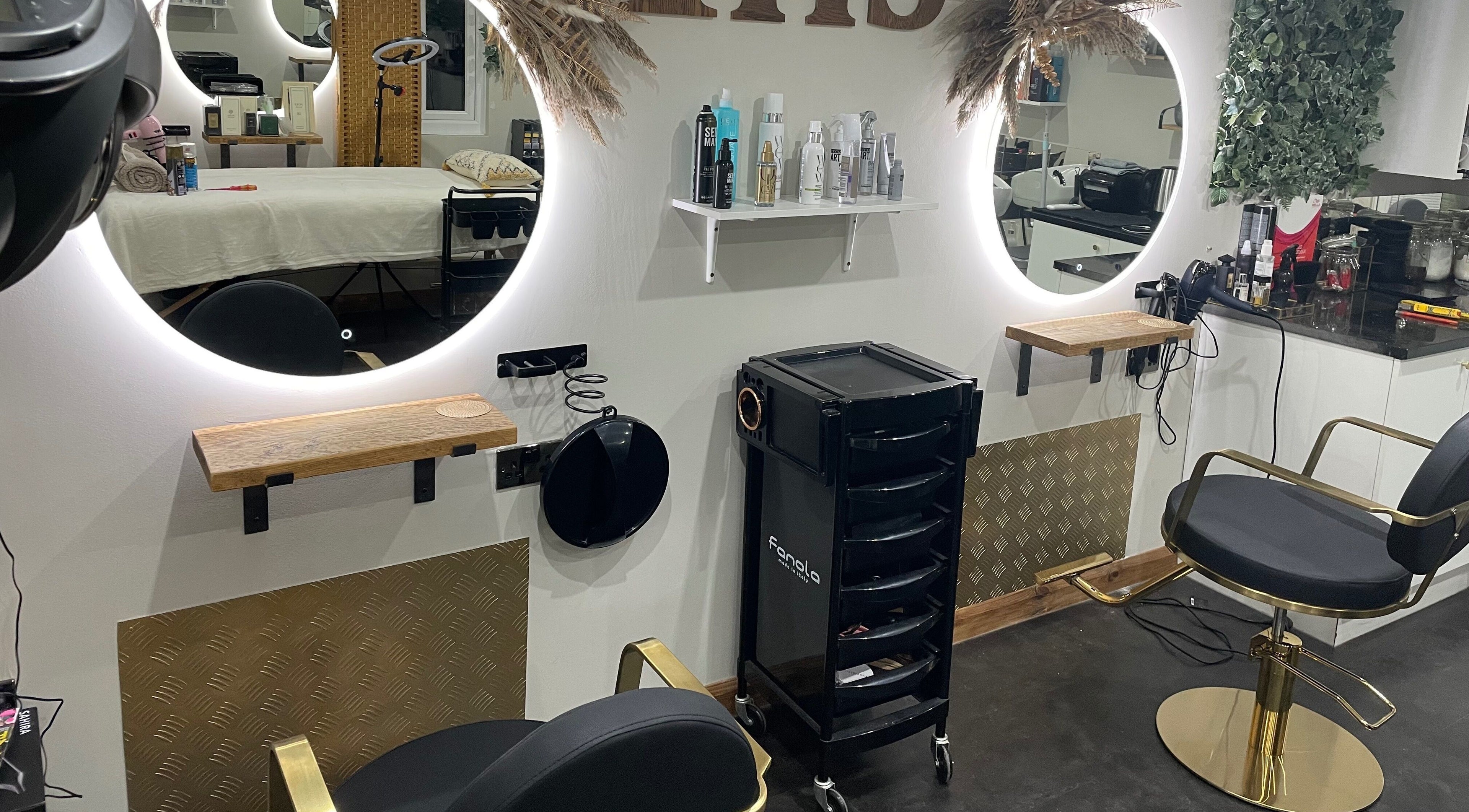 Elegant salon setup at Ivory Hair by Franki in Rochester, England, GB featuring sleek salon chairs and mirrors.