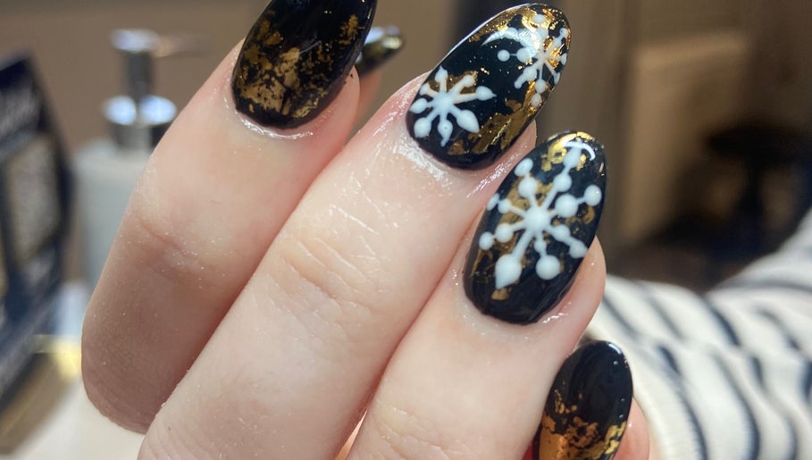 Stunning snowflake nail art at Nail Care by Claire in Tenterden, England, GB. Perfect for winter elegance.