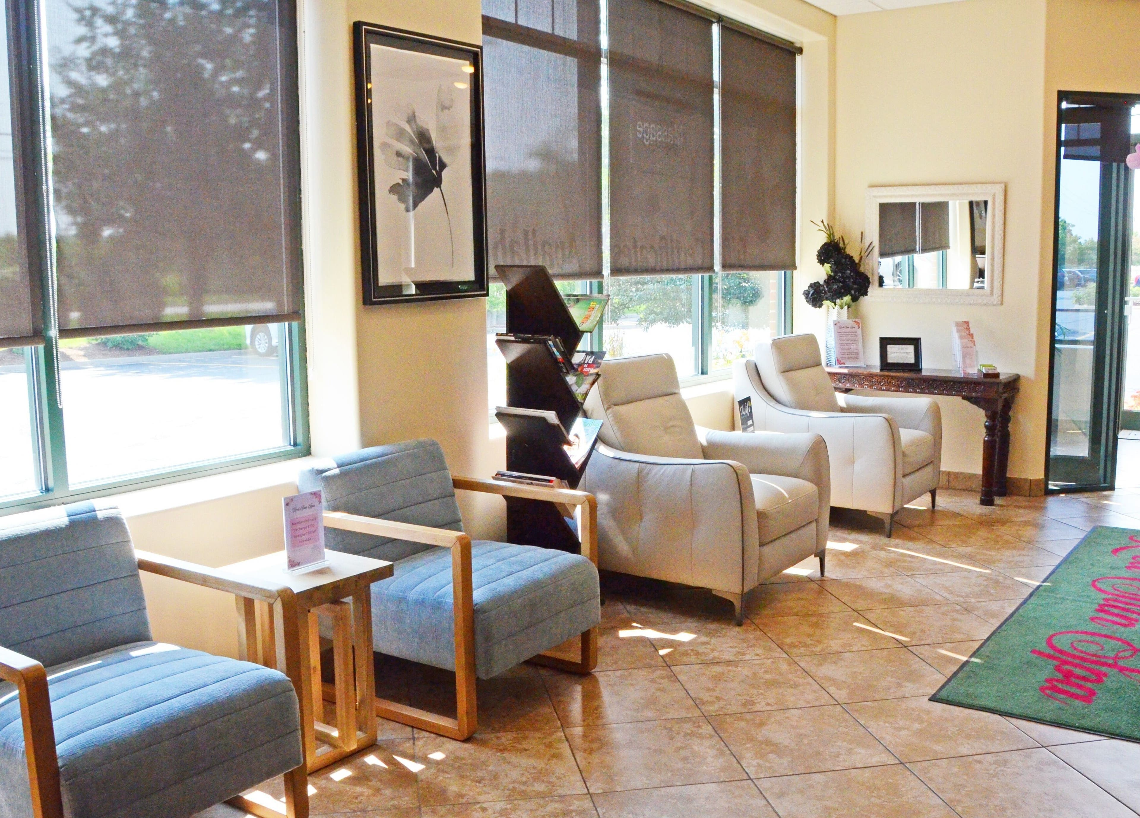 Inviting lobby at Red Sun Spa, Naperville, Illinois, US, featuring comfy seating and bright windows.