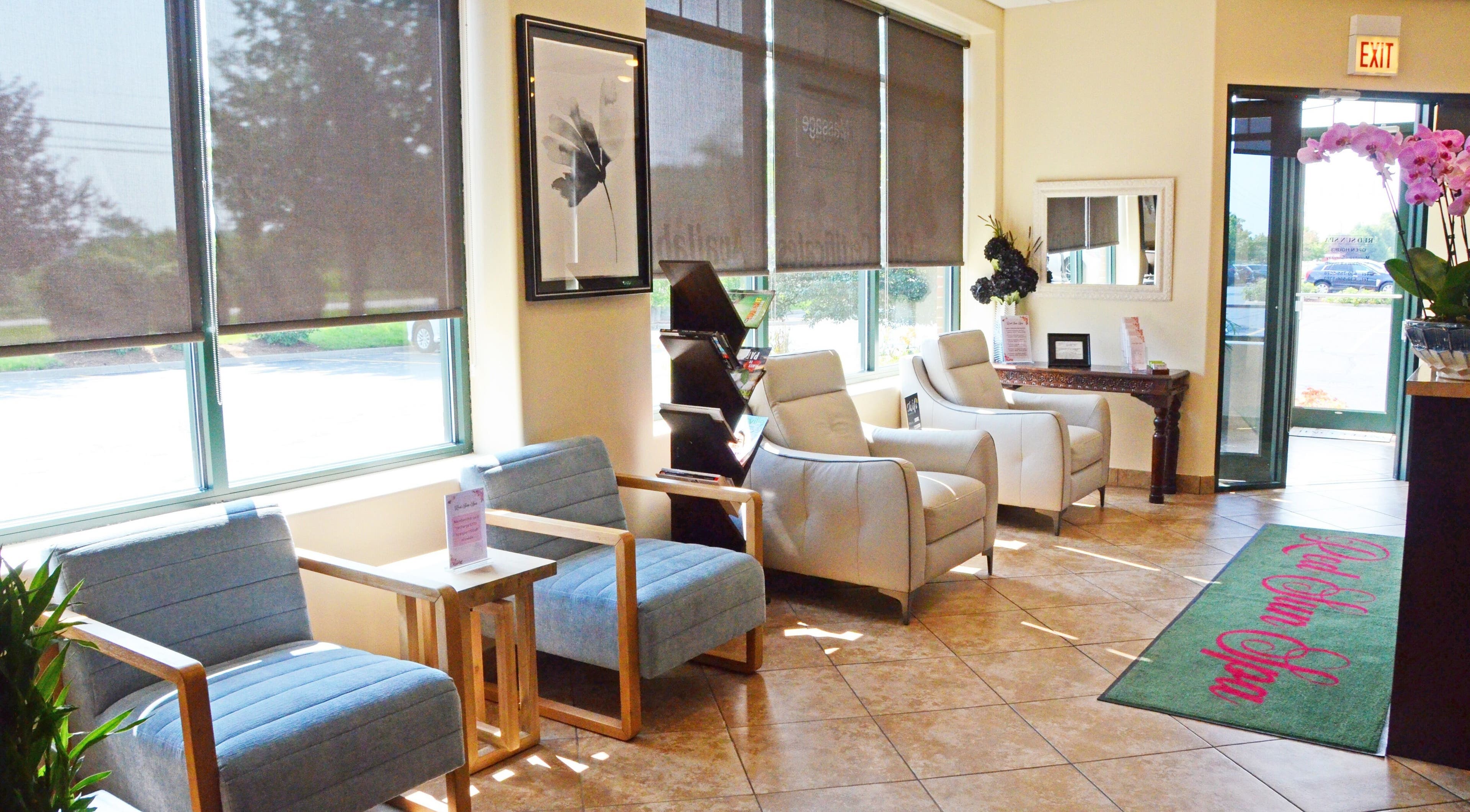 Inviting lobby at Red Sun Spa, Naperville, Illinois, US, featuring comfy seating and bright windows.