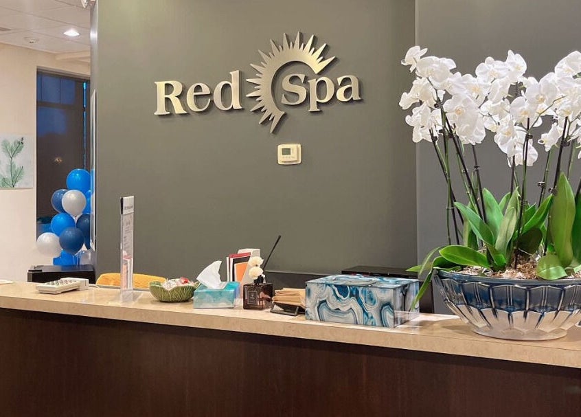 Reception desk at Red Sun Spa, Naperville, Illinois, US with elegant decor and welcoming atmosphere.