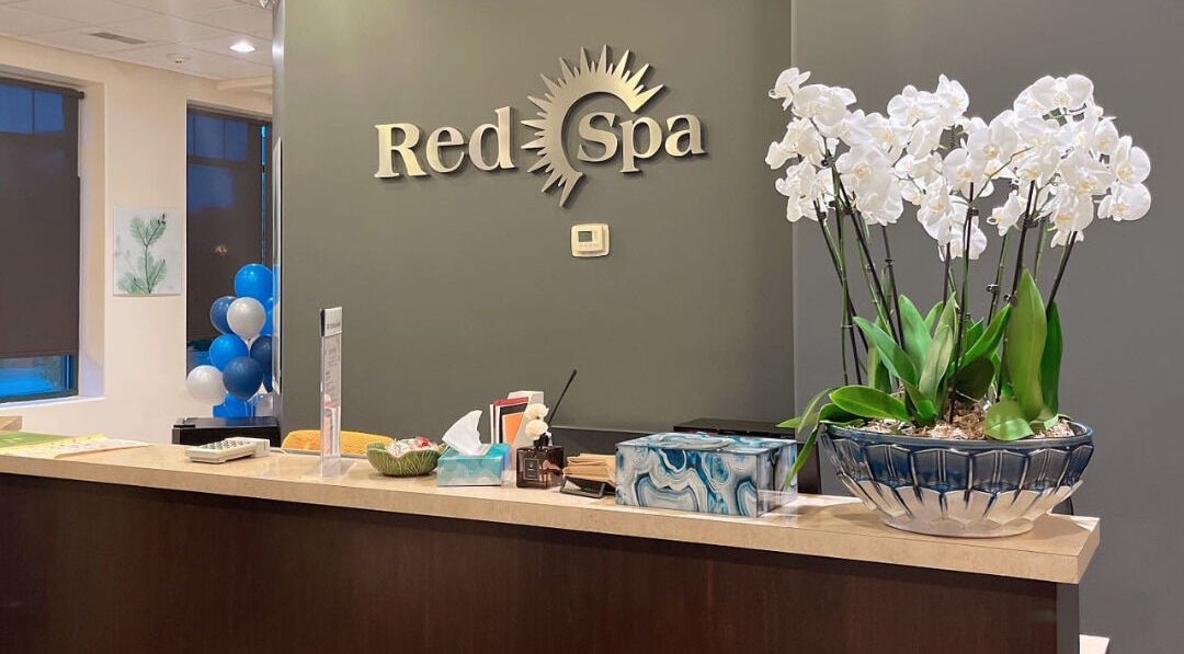 Reception desk at Red Sun Spa, Naperville, Illinois, US with elegant decor and welcoming atmosphere.