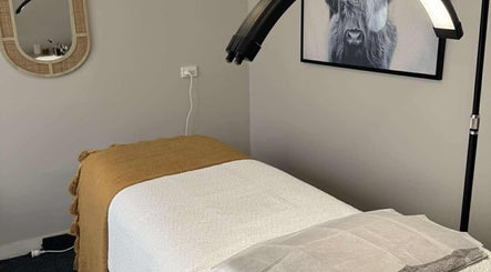 Treatment bed in Haven Beauty, Taupō, Waikato, NZ, under soft lighting with wall art.