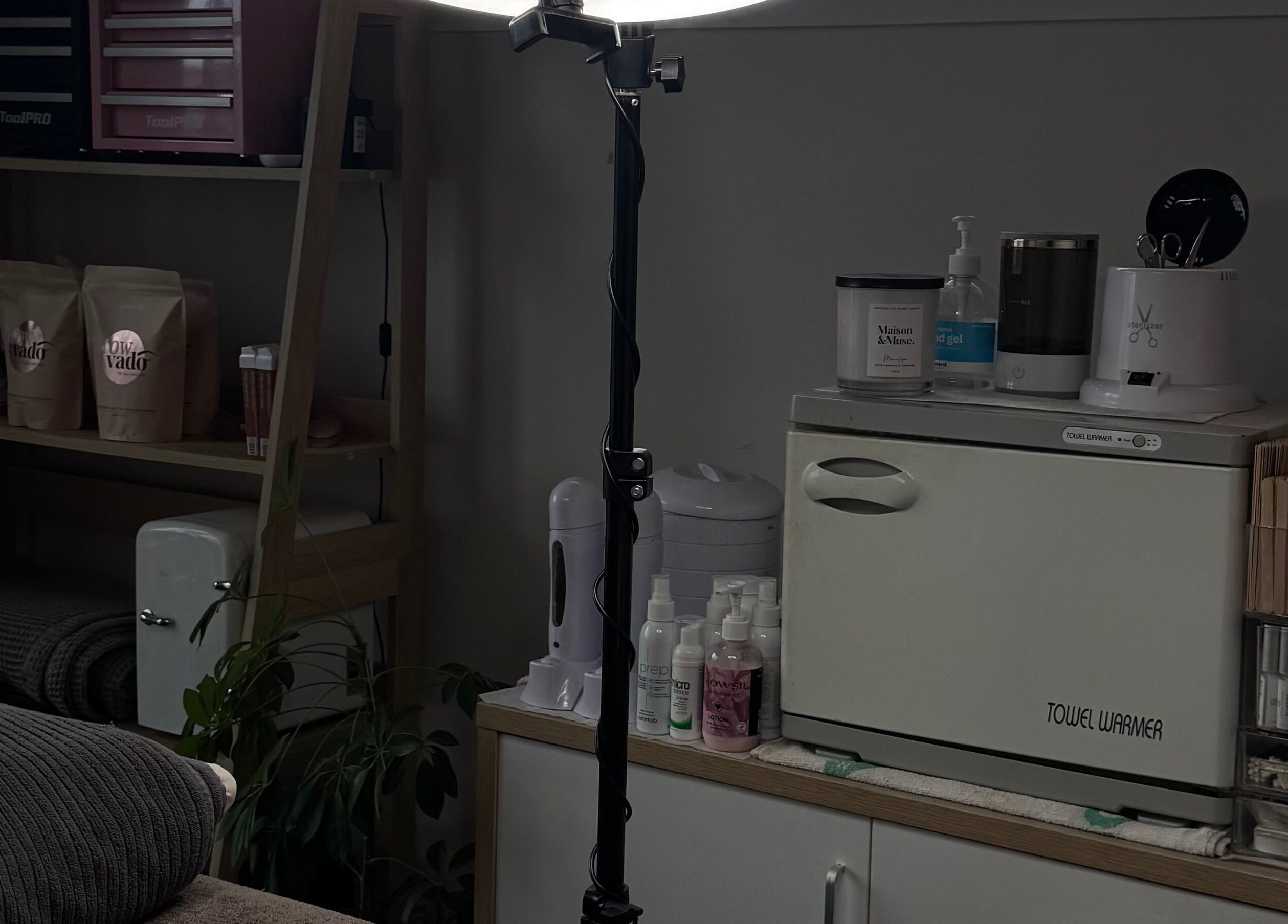 Spa essentials and equipment at 09 Brows in Auckland, Auckland, NZ, featuring towel warmer and skincare products.