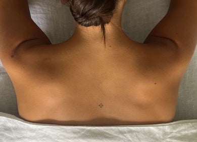 A person lying face down during a massage at Framework by miranda - Sydney studio, Paddington, New South Wales, AU.