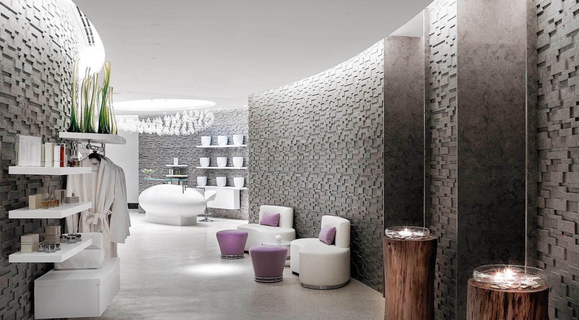 Modern lounge at Sofitel Spa Dubai Downtown, Dubai, featuring chic seating and ambient lighting.