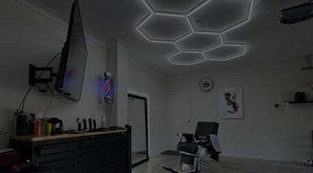 Chic barber room at Vision Studio, Coomera, Queensland, AU with stylish lighting and barber chair.