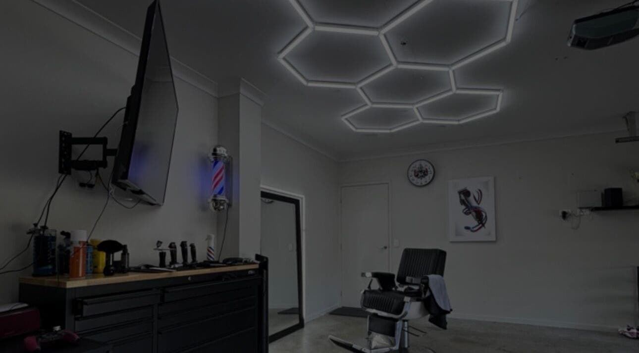 Chic barber room at Vision Studio, Coomera, Queensland, AU with stylish lighting and barber chair.