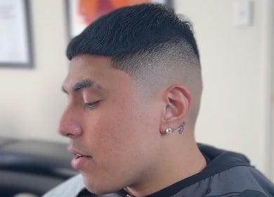 Close-up of a modern haircut at Vision Studio, Coomera, Queensland, AU, showcasing a clean fade and side profile.