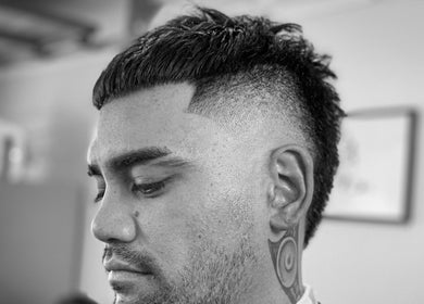 A modern fade haircut at Vision Studio in Coomera, Queensland, AU, highlighting professional grooming.