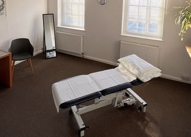 Modern treatment room with a comfortable bed at The Green Parrot Clinic in Swaffham, England, GB.