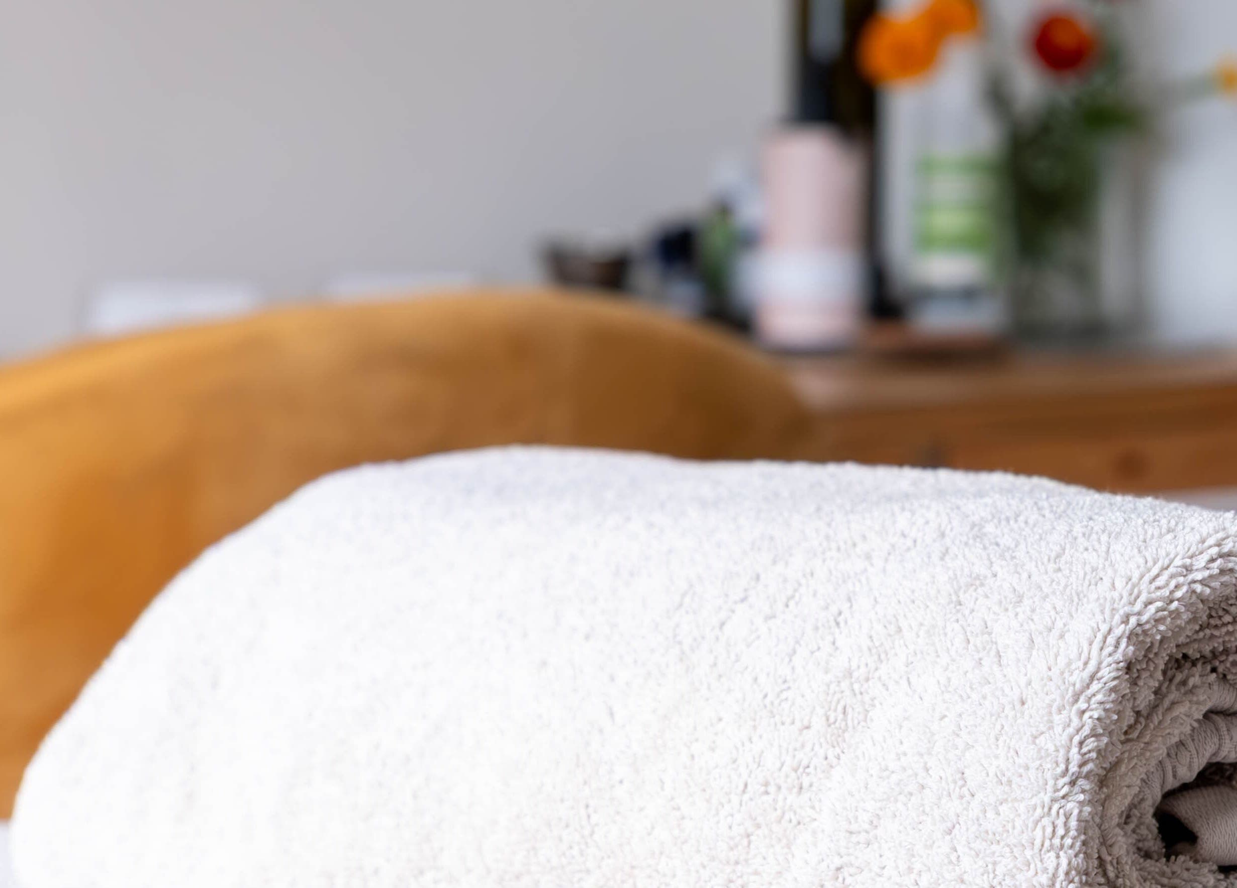 Soft towels at Sharn - Massage Therapist, Cape Town, Western Cape, ZA, create a serene atmosphere for relaxation.