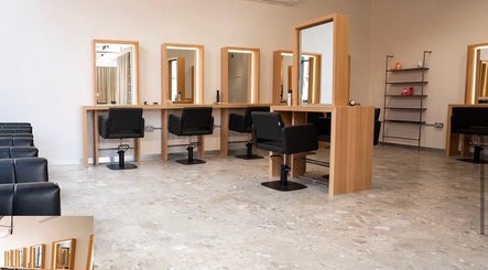 Spacious beauty studio at Amber Grace Artistry, Sheffield, England, GB, with sleek chairs and vanity mirrors.