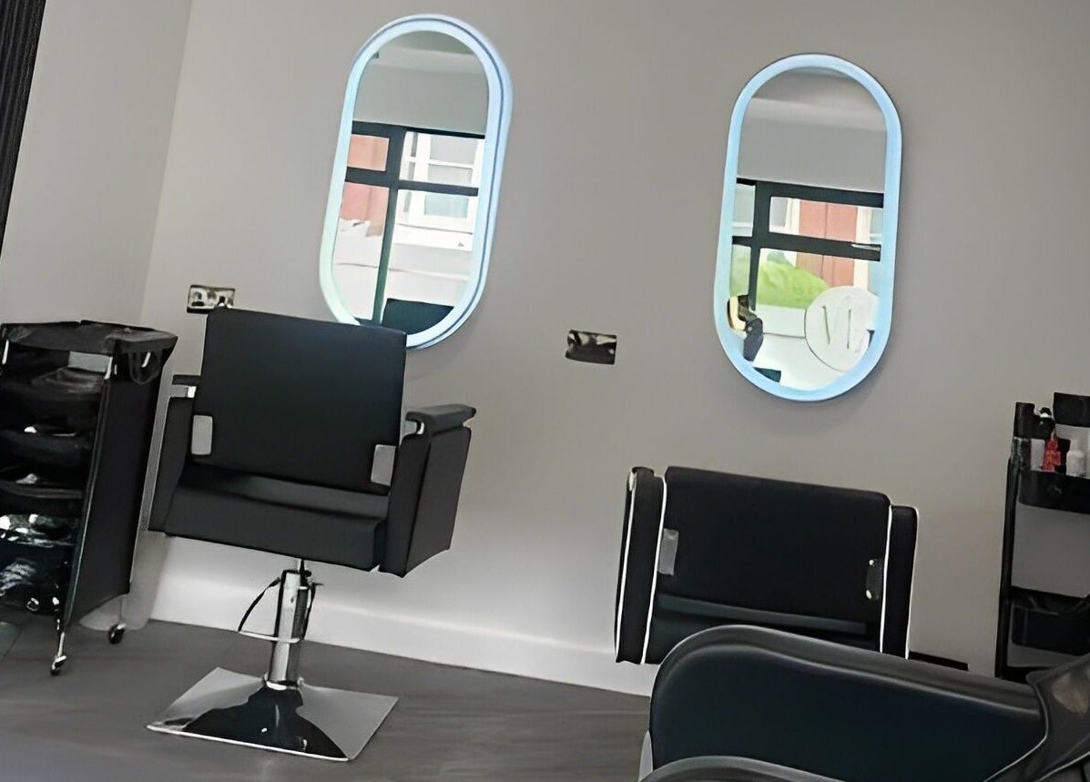 Elegant salon setup at By Via, Blackpool, England, GB featuring modern chairs and mirrors.