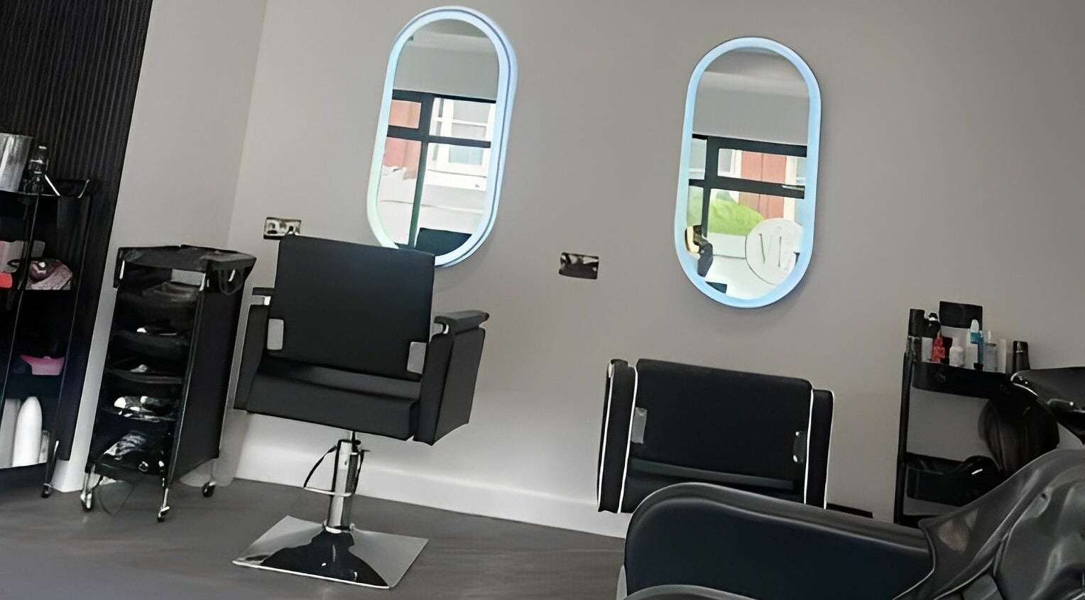 Elegant salon setup at By Via, Blackpool, England, GB featuring modern chairs and mirrors.