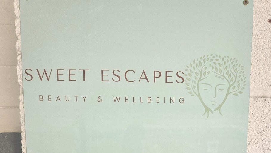 Sweet Escapes Beauty & Wellbeing sign at Rolleston-on-Dove, England, GB, featuring a serene logo design.
