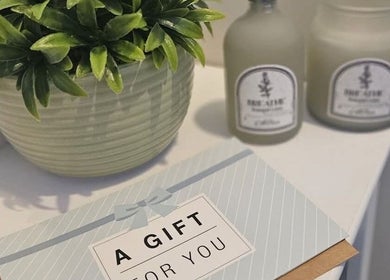 Gift card beside plant and candles at Sweet Escapes Beauty & Wellbeing, Rolleston-on-Dove, England, GB.