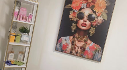 Vibrant wall art and beauty products at Sweet Escapes Beauty & Wellbeing, Rolleston-on-dove, England, GB.