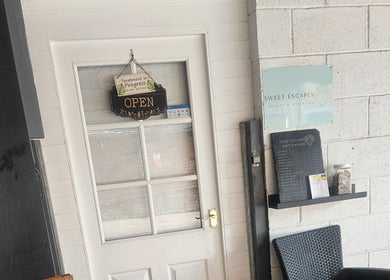 Front entrance of Sweet Escapes Beauty & Wellbeing, Rolleston-on-dove/Stretton, England with an open sign.