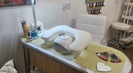 Elegant nail station at Sweet Escapes Beauty & Wellbeing in Rolleston-on-dove, England, GB, showcasing tools and polishes.