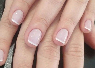 French manicure at Sweet Escapes Beauty & Wellbeing, Rolleston-on-dove, England, GB showcasing intricate nail art.