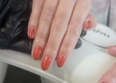 Manicured nails with glossy polish at Sweet Escapes Beauty & Wellbeing, Rolleston-on-dove, England, GB.