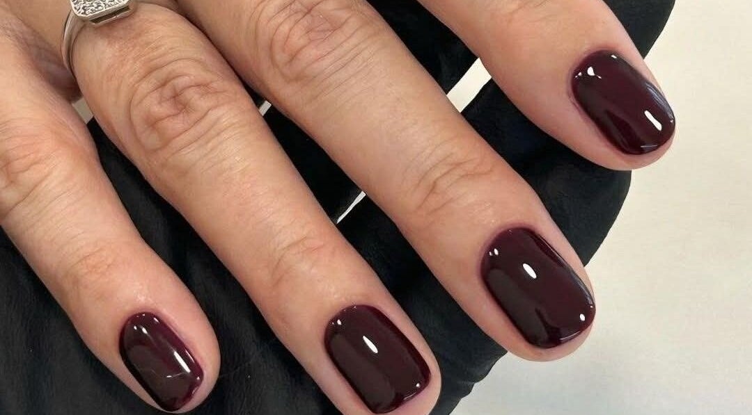 Stylish dark manicure at Sweet Escapes Beauty & Wellbeing, Rolleston-on-dove, England, GB.