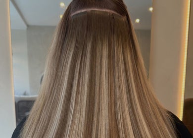 Smooth, long highlighted hair at Katie at Outback, Dunfermline, Scotland, GB salon.