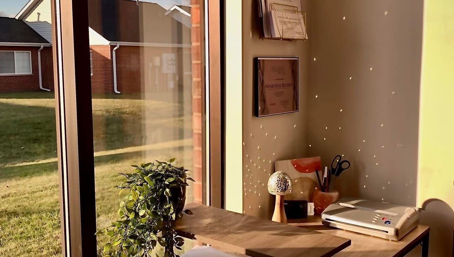 Cozy corner at Ebb and Flow Studio IL, Peru, Illinois, with window view and tidy desk.