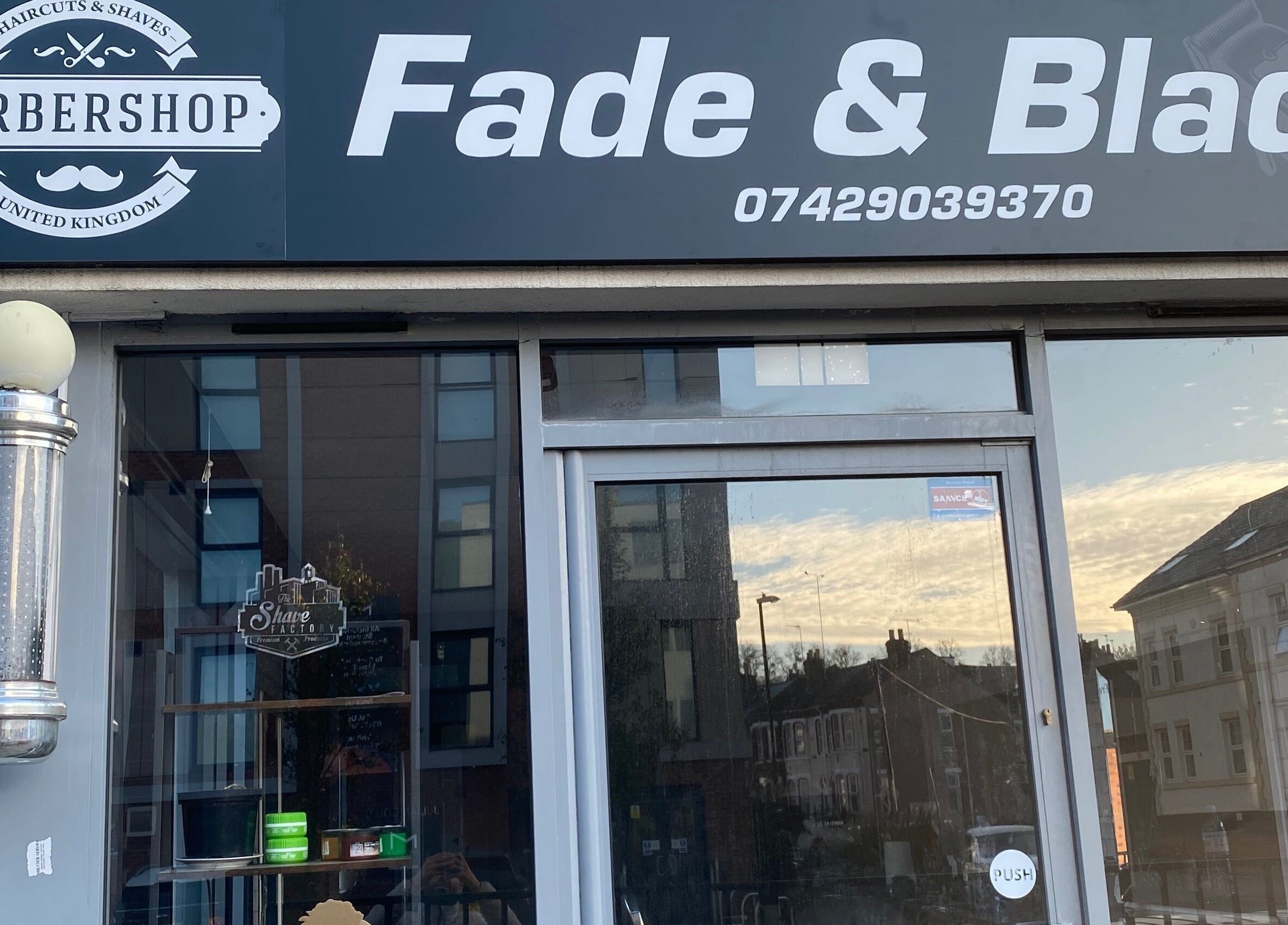 Fade and Blade barbershop entrance in Coventry, England, GB, showcasing modern signage and inviting exterior.