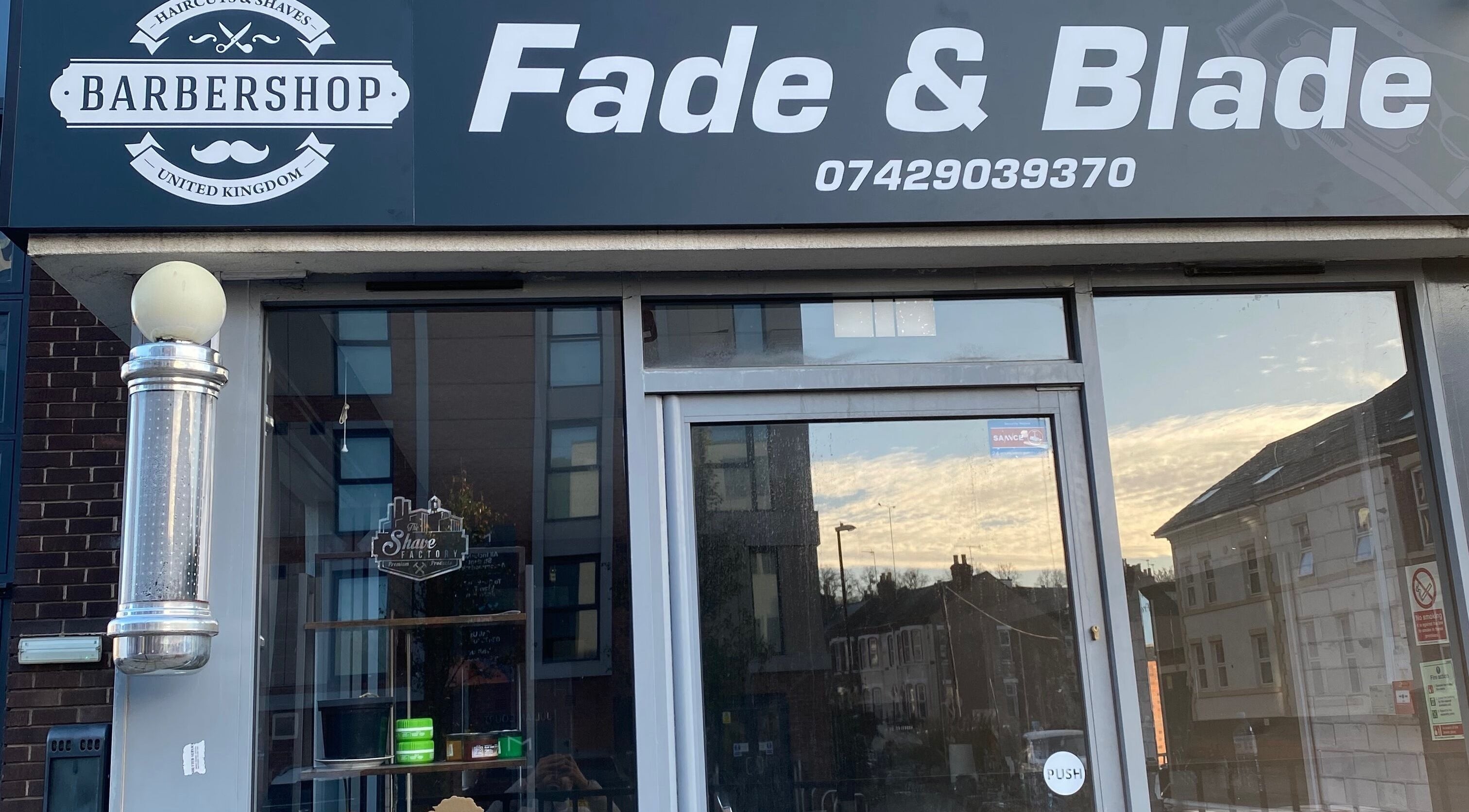 Fade and Blade barbershop entrance in Coventry, England, GB, showcasing modern signage and inviting exterior.