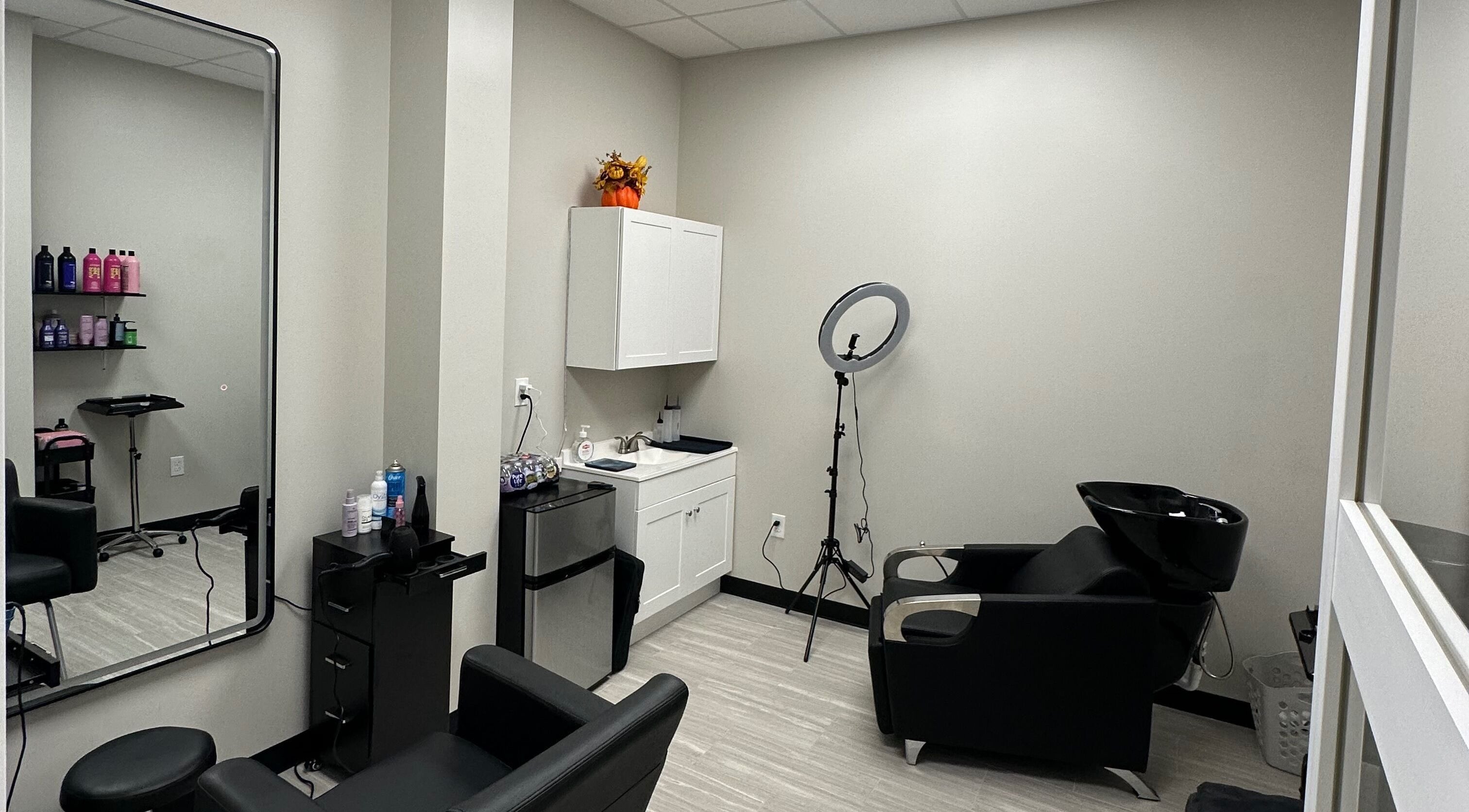 Modern salon setup at Royal Beauty by Amy, Lehigh Acres, Florida, US. Features styling chair and ring light.