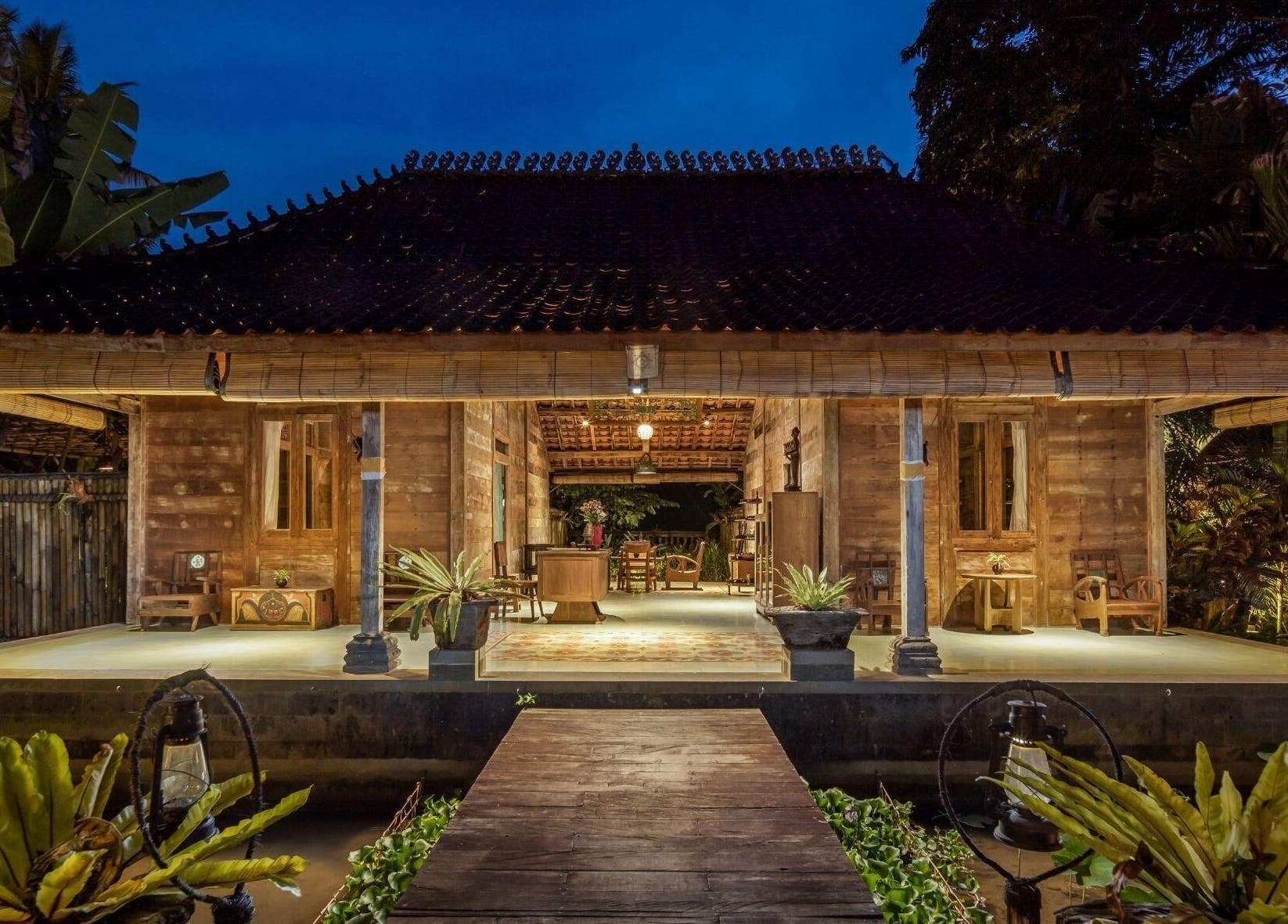 Charming night view of 1919 Spa's wooden exterior, Bali, Bali, ID, creates a tranquil atmosphere.