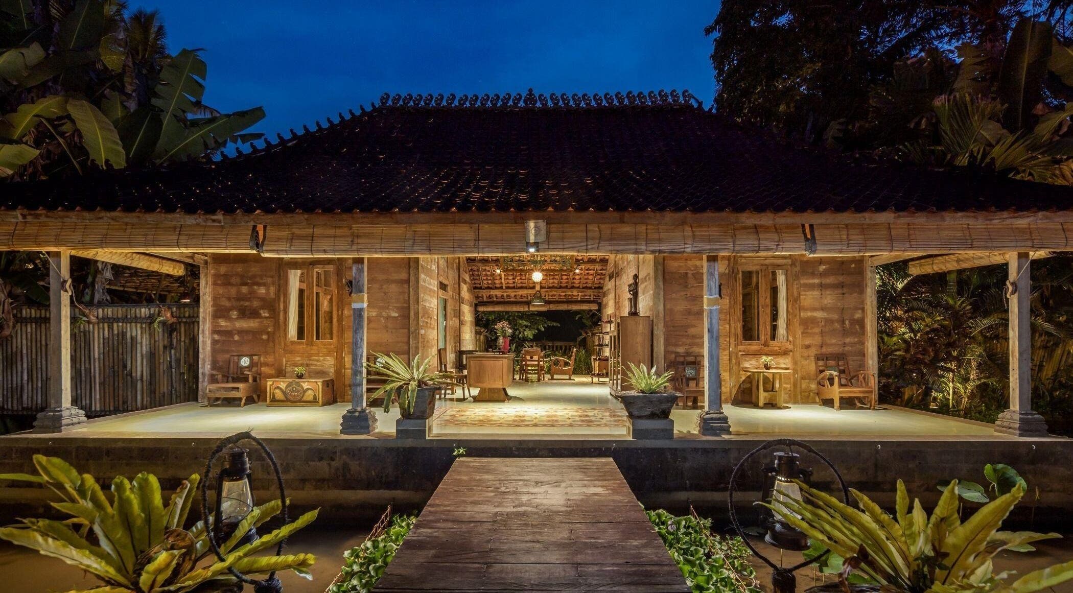 Charming night view of 1919 Spa's wooden exterior, Bali, Bali, ID, creates a tranquil atmosphere.