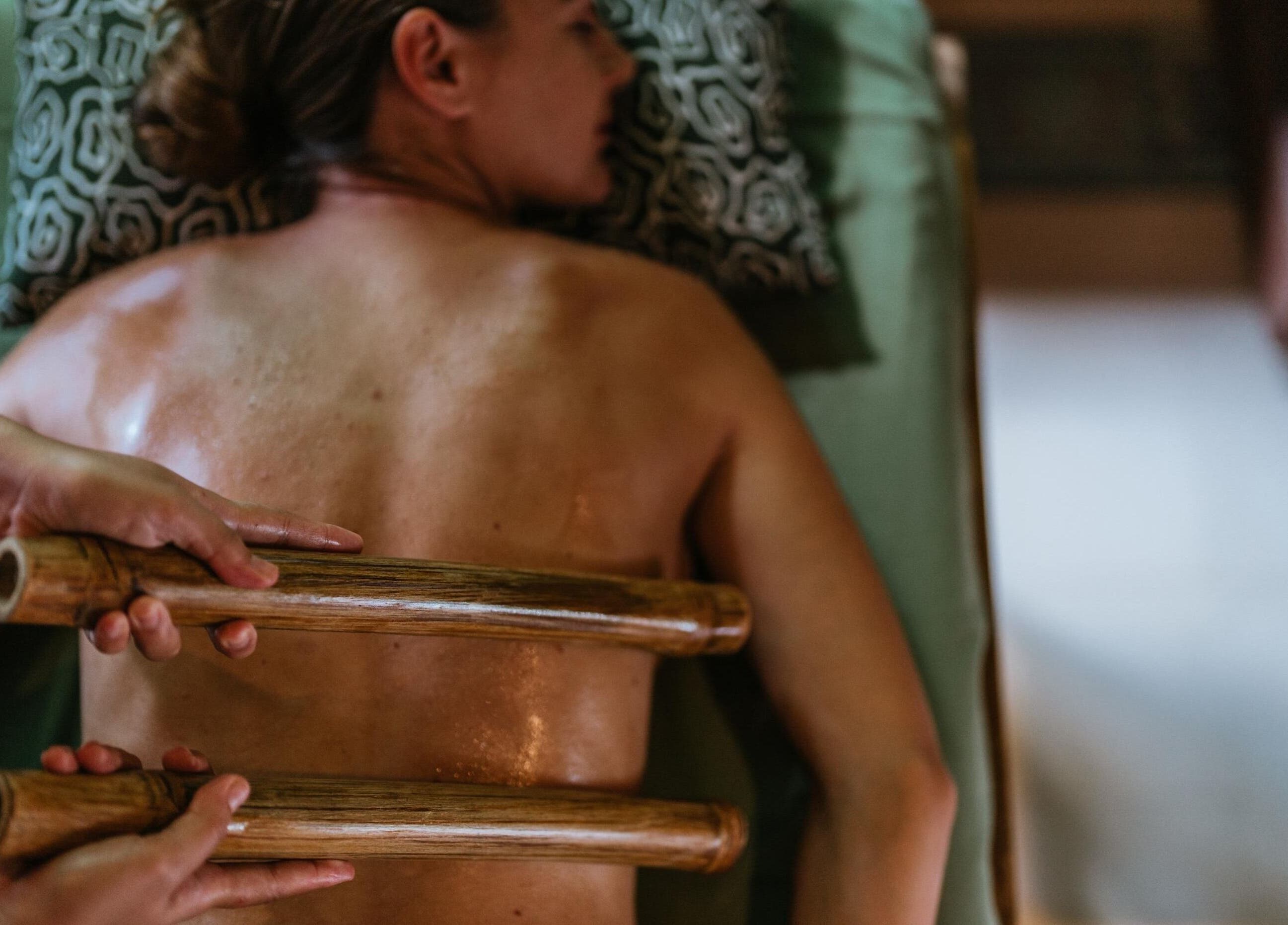 Relaxing bamboo massage at 1919 Spa, Bali, Bali, ID enhances wellness and tranquility.