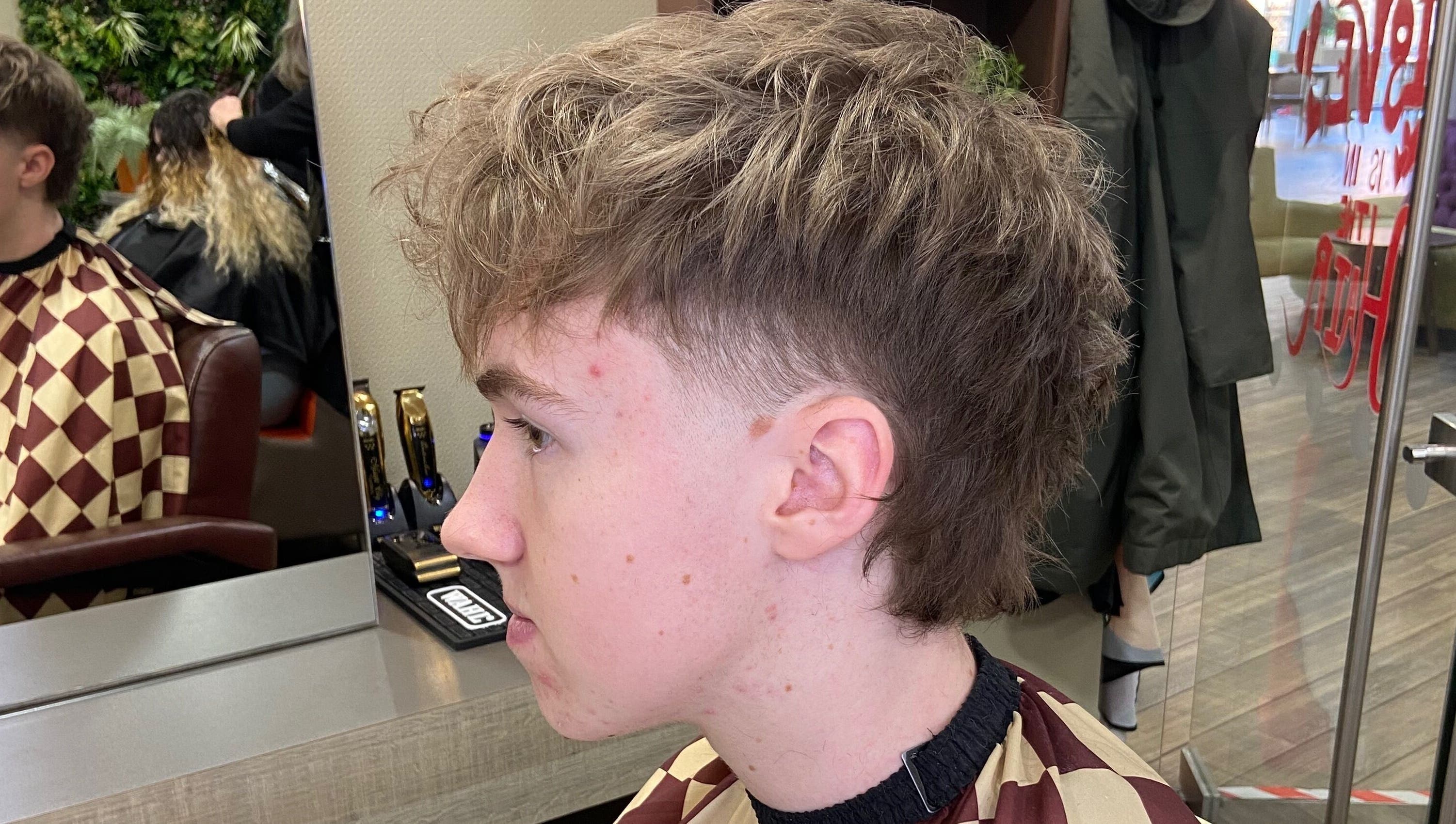 Side view of a trendy haircut at Jay’s Barbering at Beaujolais Hair, Dunstable, England, GB.