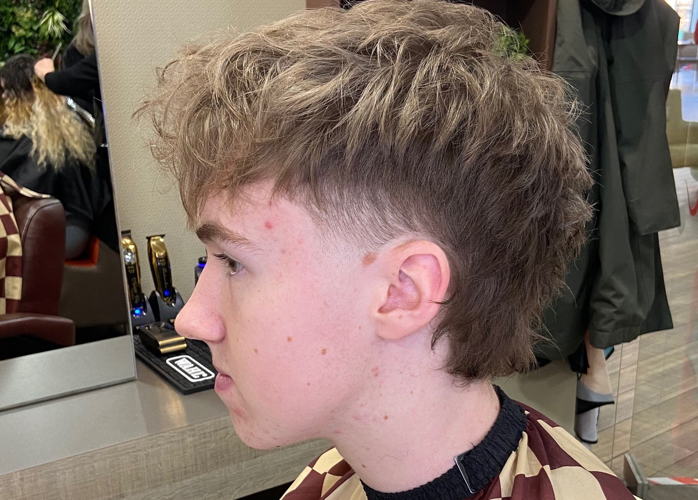 Side view of a trendy haircut at Jay’s Barbering at Beaujolais Hair, Dunstable, England, GB.