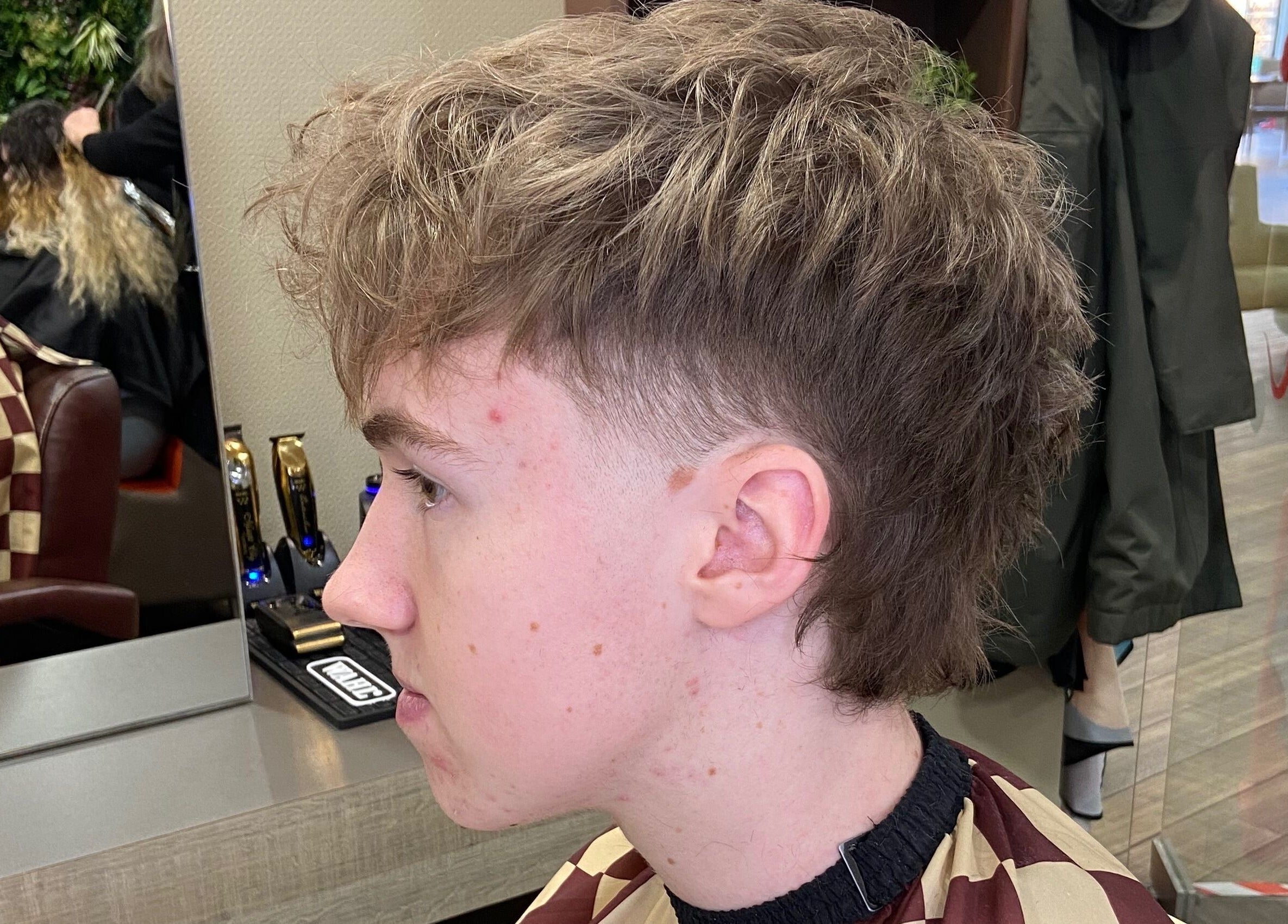 Side view of a trendy haircut at Jay’s Barbering at Beaujolais Hair, Dunstable, England, GB.