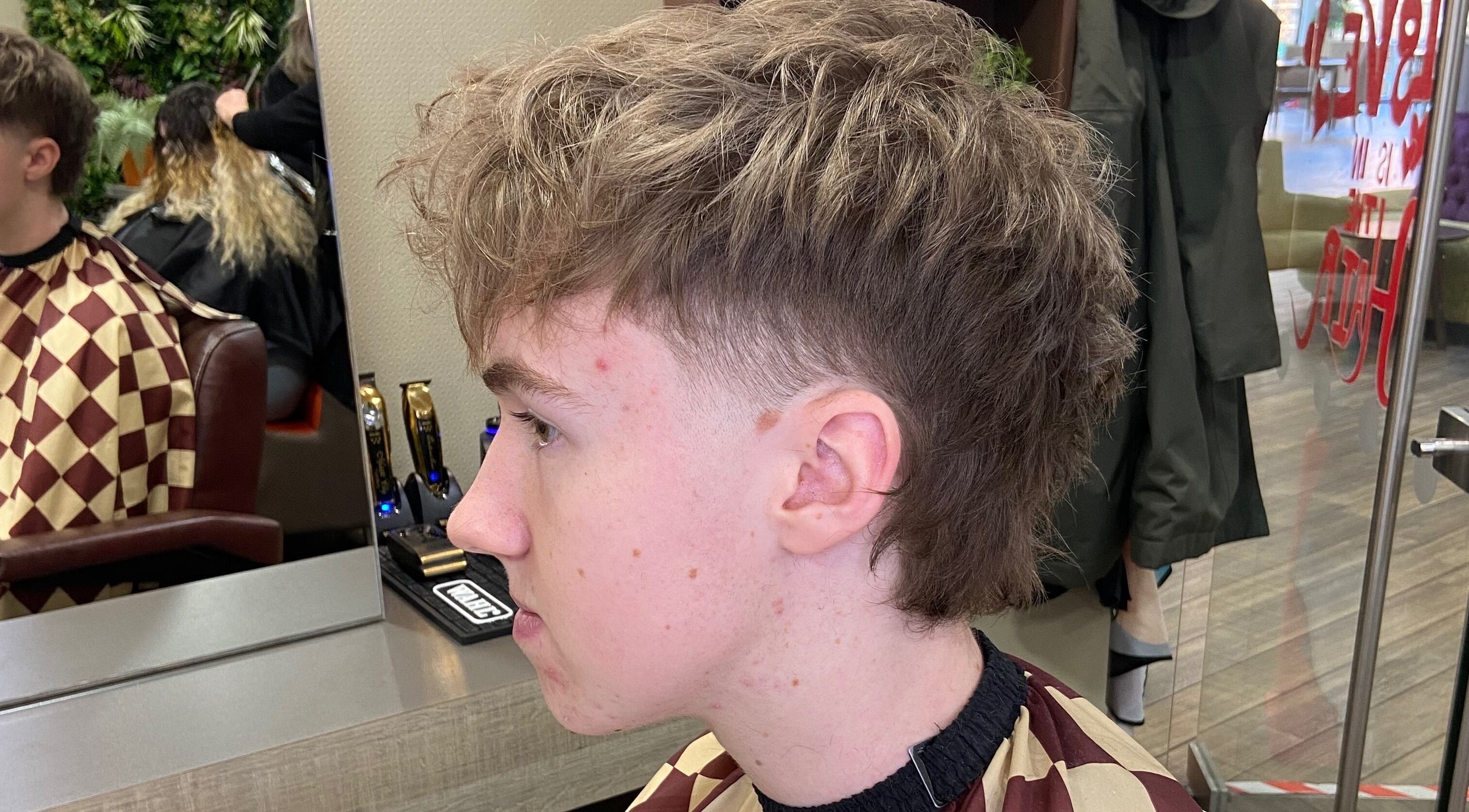 Side view of a trendy haircut at Jay’s Barbering at Beaujolais Hair, Dunstable, England, GB.