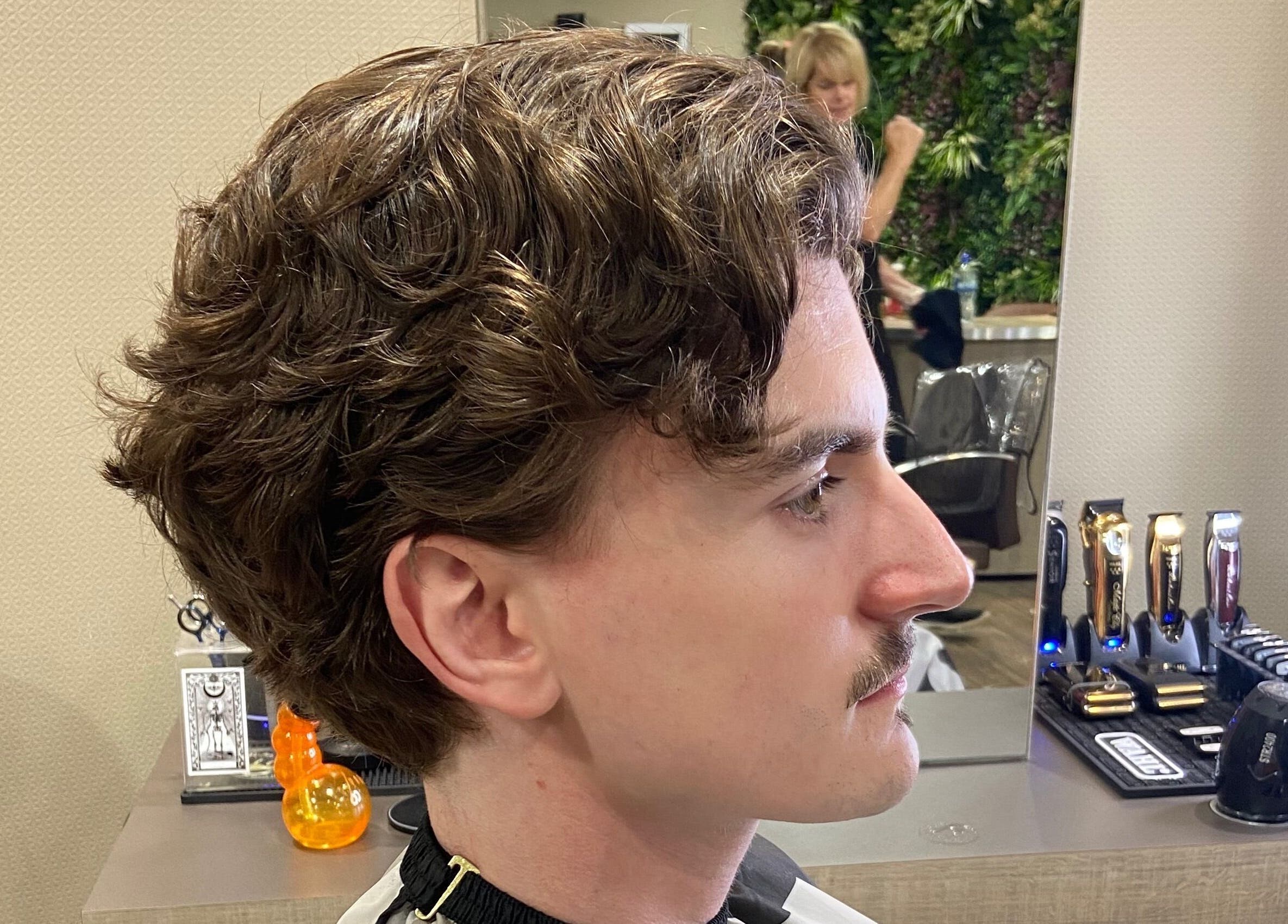 Man receiving a stylish haircut at Jay’s Barbering at Beaujolais Hair in Dunstable, England, GB.