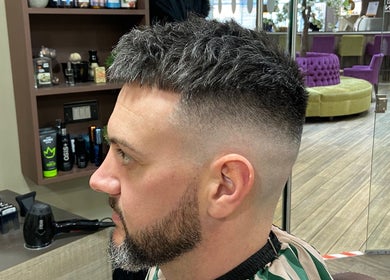 Modern fade haircut at Jay's Barbering at Beaujolais Hair in Dunstable, England, GB.