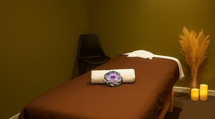 Tranquil massage room at Anda Thai Massage (CBD) in Melbourne, Victoria, AU with calming decor and a cozy bed.