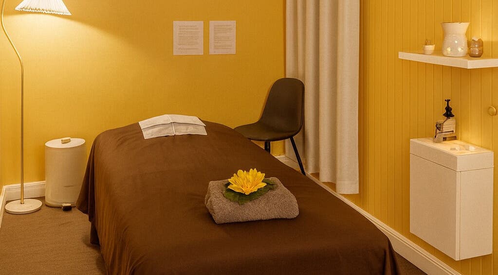 Anda Thai Massage (Balwyn) tranquil room in Melbourne, Victoria, AU with a bed and serene decor.