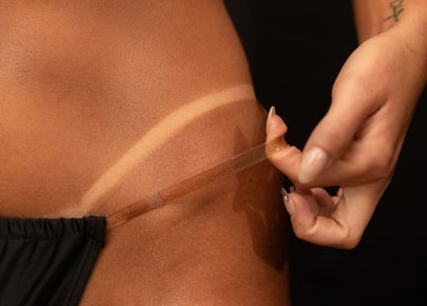 Close-up of a tan line being revealed at Glory Glow 2G Mobile Spray Tan Greater Scottsdale, Scottsdale, Arizona, US.